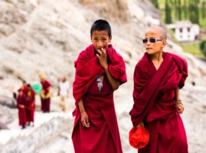 Young Buddhist Monks in Ladakh children in traditional maroon robes, symbolizing the vibrant monastic life of the Himalayas
