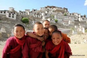 Young Buddhist Monks in Ladakh monastic life with monastery backdrop